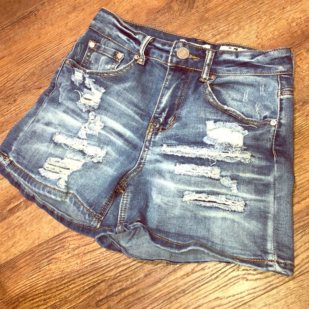 High-waisted distressed jean shorts